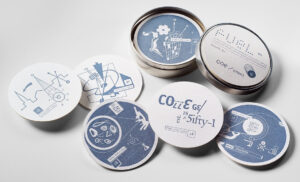 Self-promotional piece consisting of letterpress coasters in a tin designed for FUEL, presented to Coe College located in Cedar Rapids, Iowa. Coe College Coasters