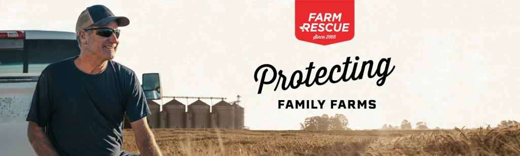 Farm Rescue volunteer sitting on truck