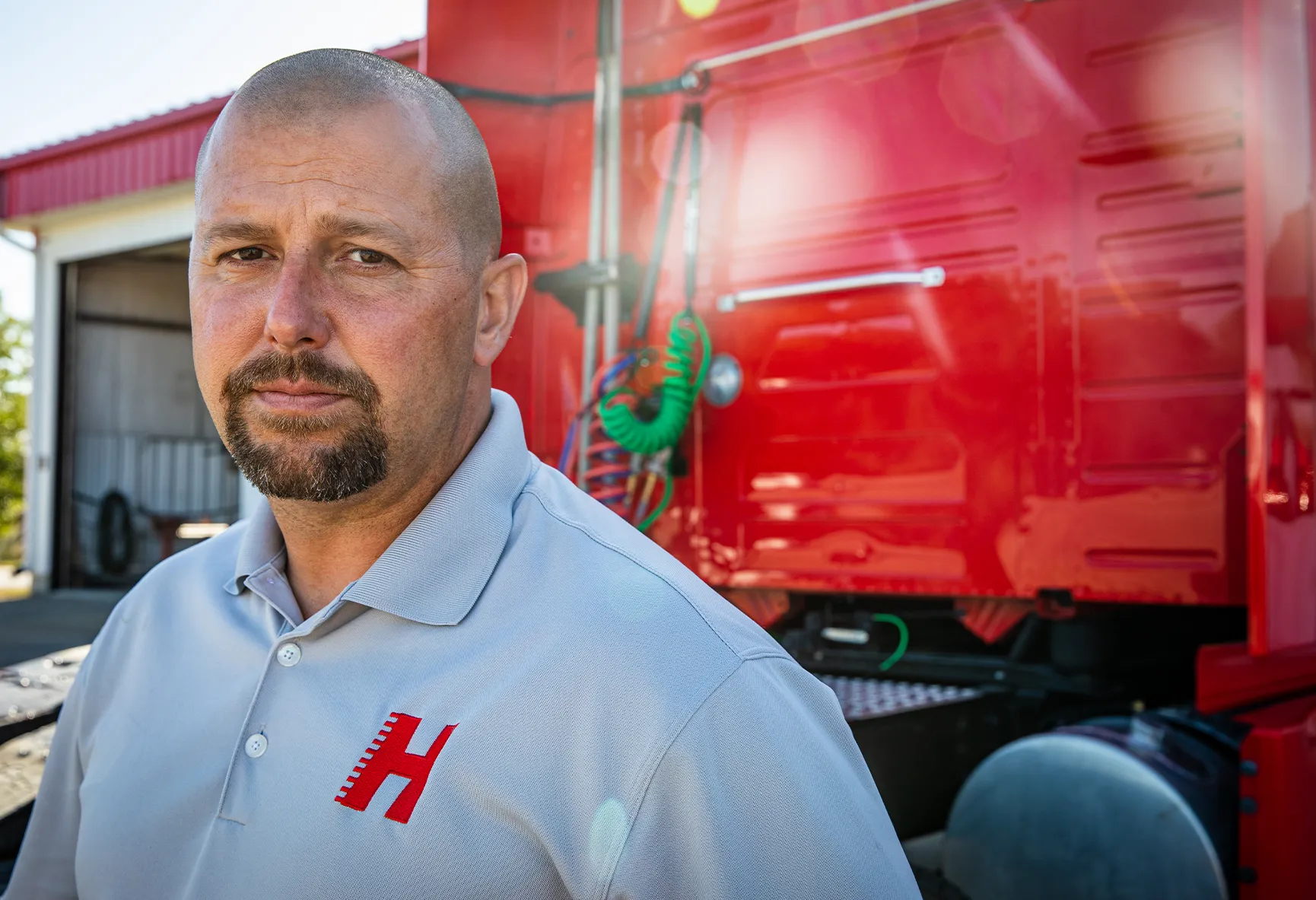 Don Hummer Trucking employee in front of truck