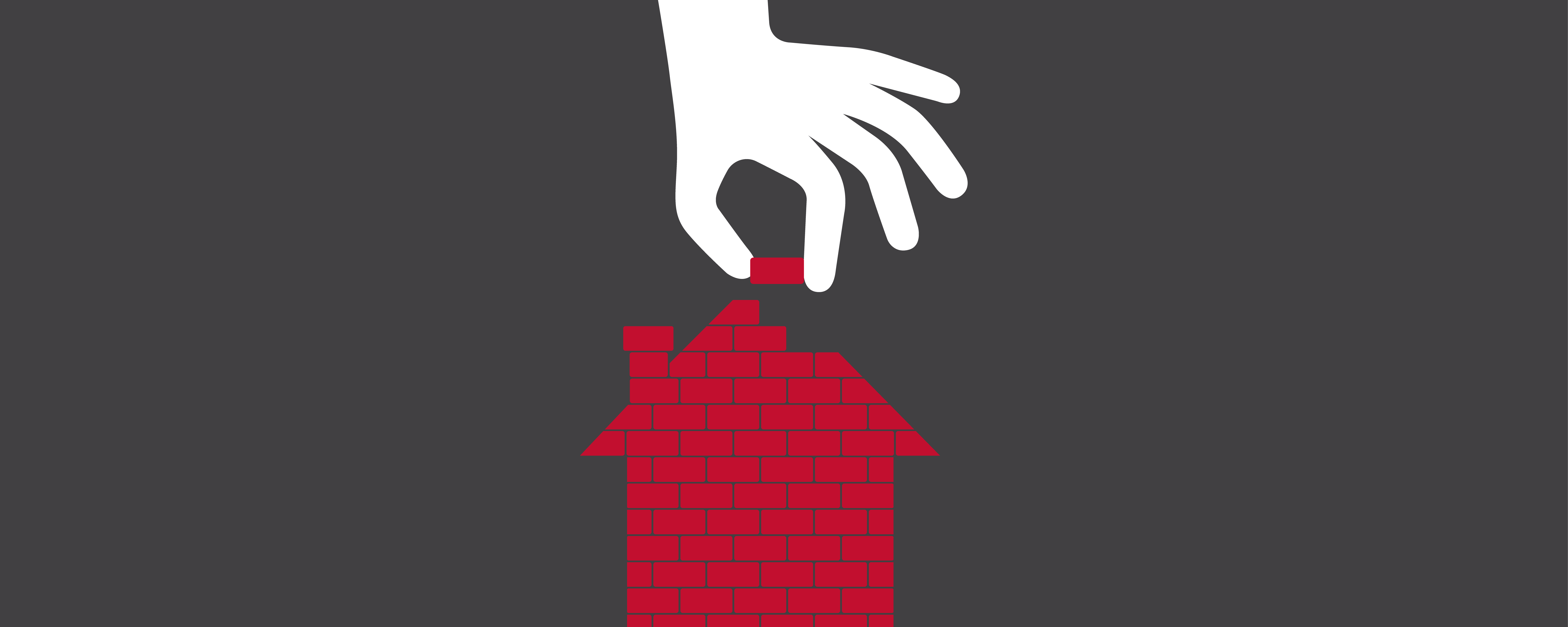 Cartoon hand placing a brick while building a house