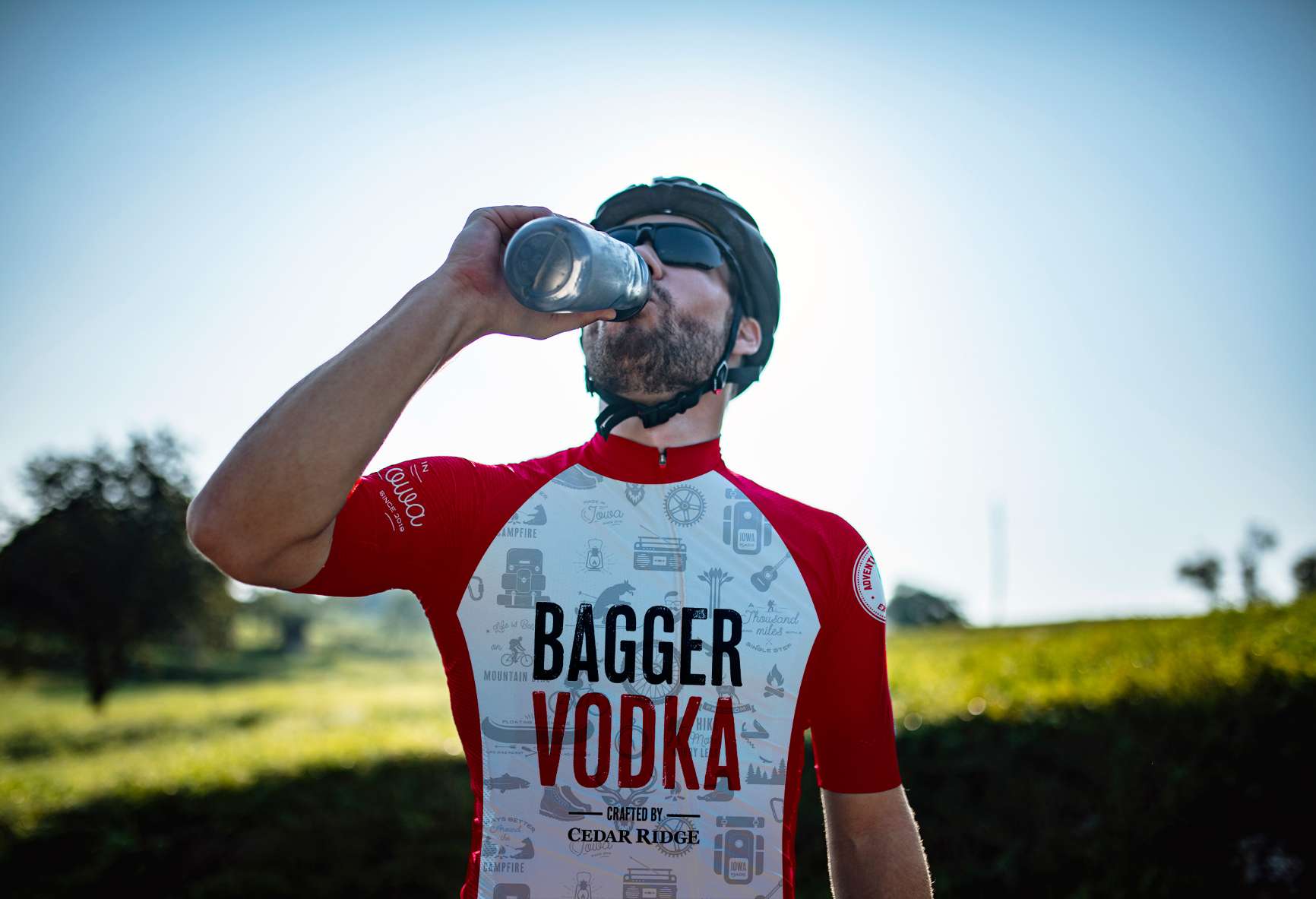 Bagger Vodka bike jersey worn by biker drinking water