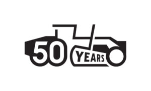 Anniversary mark for the 50th anniversary of the John Deere motor grader, designed for John Deere Construction, a heavy industrial construction equipment manufacturer located in Moline, Illinois. John Deere Motorgrader 50-year Anniversary